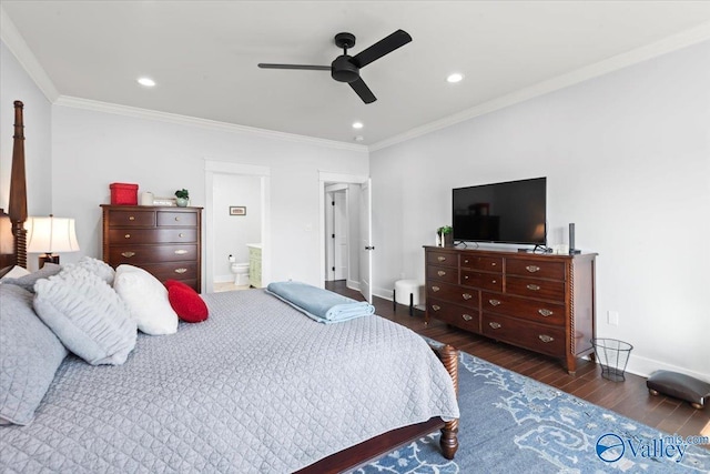 bedroom with crown molding, dark hardwood / wood-style floors, ceiling fan, and ensuite bathroom