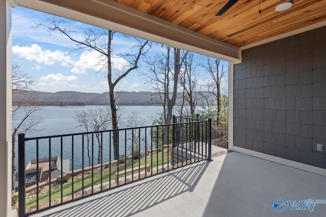 balcony with a water and mountain view