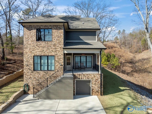 front of property featuring a garage and covered porch