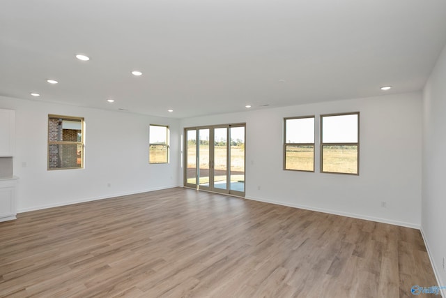 unfurnished room featuring light hardwood / wood-style flooring