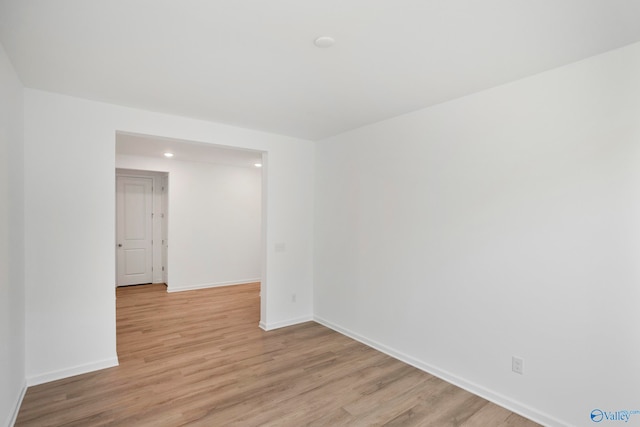 spare room with light hardwood / wood-style floors