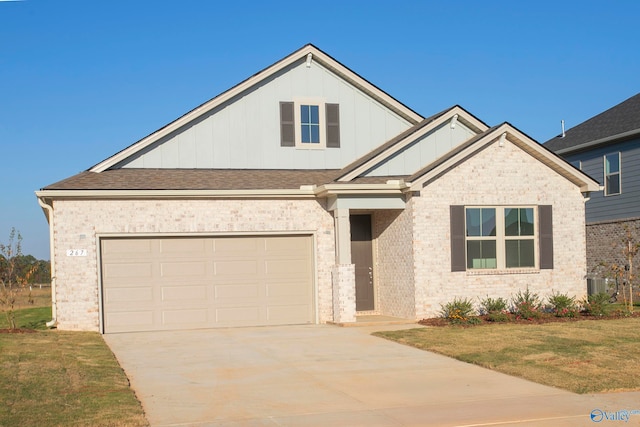 view of front of home with a garage and a front yard