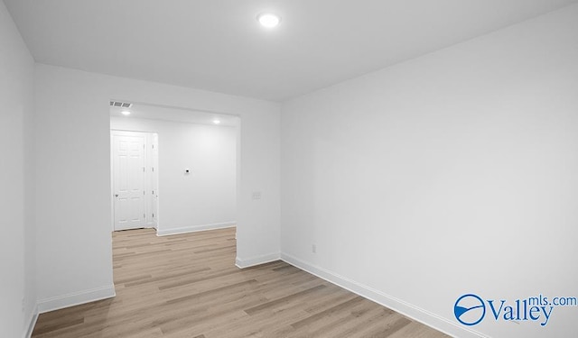 unfurnished room with light hardwood / wood-style floors