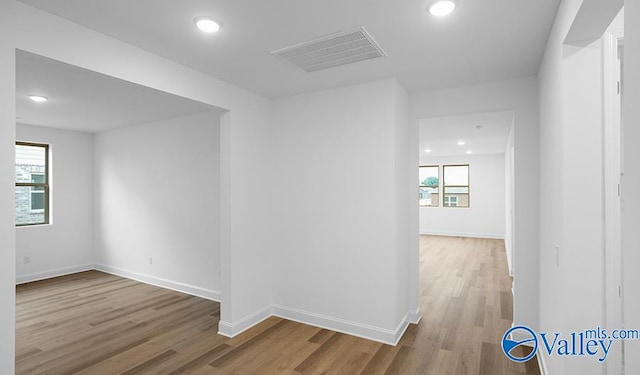 unfurnished room featuring light hardwood / wood-style floors