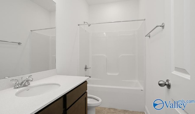 full bathroom with tile patterned floors, vanity, toilet, and tub / shower combination