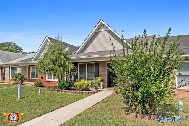 obstructed view of property featuring a front yard