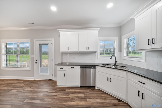 kitchen with stainless steel dishwasher, dark wood-type flooring, visible vents, a sink, and decorative backsplash