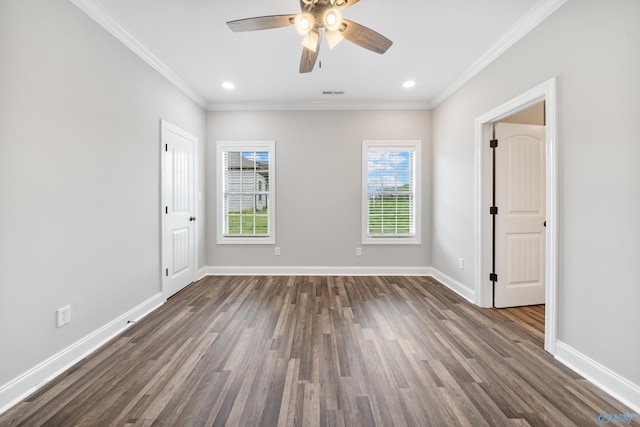 empty room with a ceiling fan, baseboards, dark wood-style floors, and visible vents