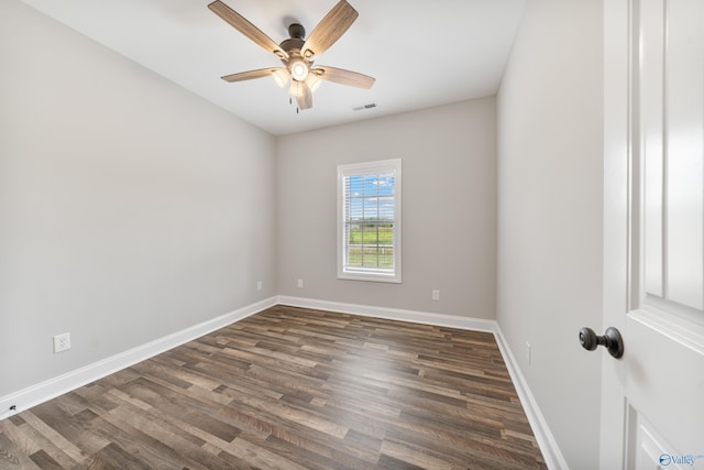unfurnished room featuring visible vents, ceiling fan, wood finished floors, and baseboards