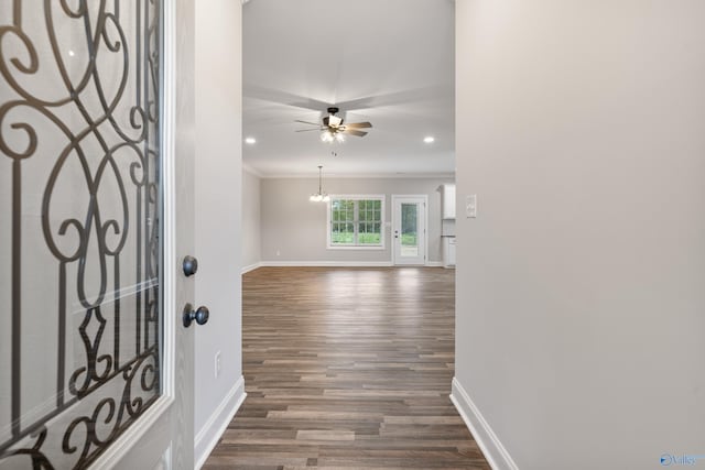 foyer entrance featuring baseboards, dark wood-style flooring, ornamental molding, a ceiling fan, and recessed lighting