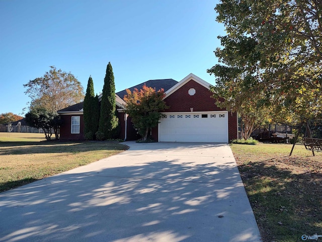 view of front facade featuring a front lawn and a garage