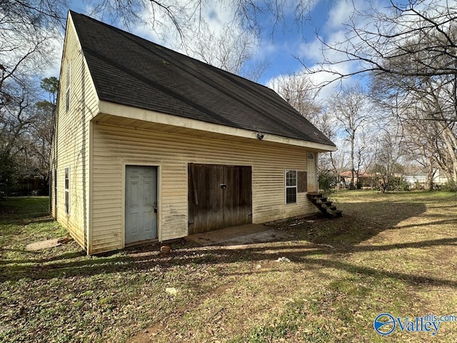 view of property exterior featuring a lawn