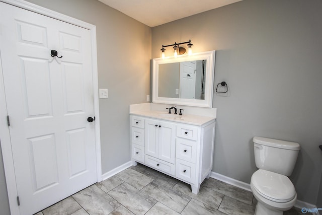 3790 Christopher Ave, Southside, AL 35907 - bathroom featuring toilet, vanity, and baseboards