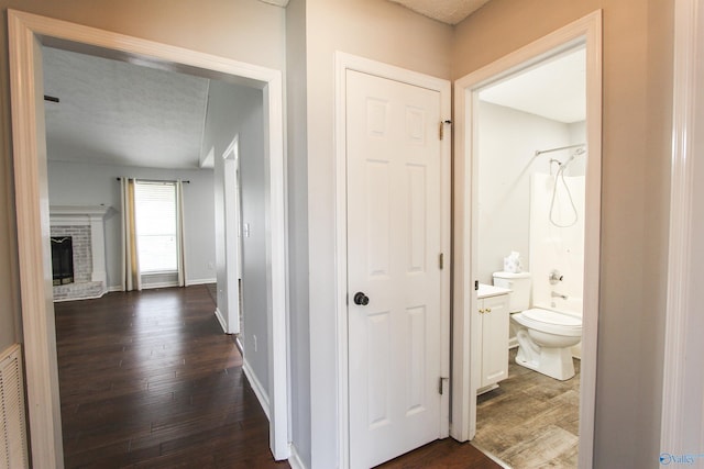 3790 Christopher Ave, Southside, AL 35907 - hallway featuring dark wood-type flooring, baseboards, and visible vents