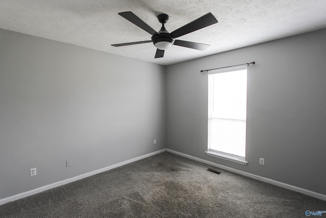 3790 Christopher Ave, Southside, AL 35907 - spare room featuring baseboards, a textured ceiling, visible vents, and dark colored carpet