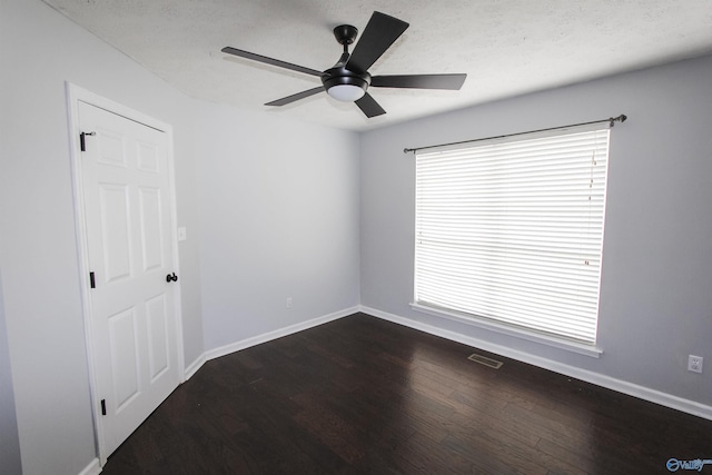 3790 Christopher Ave, Southside, AL 35907 - unfurnished room featuring dark wood-type flooring, baseboards, ceiling fan, and visible vents