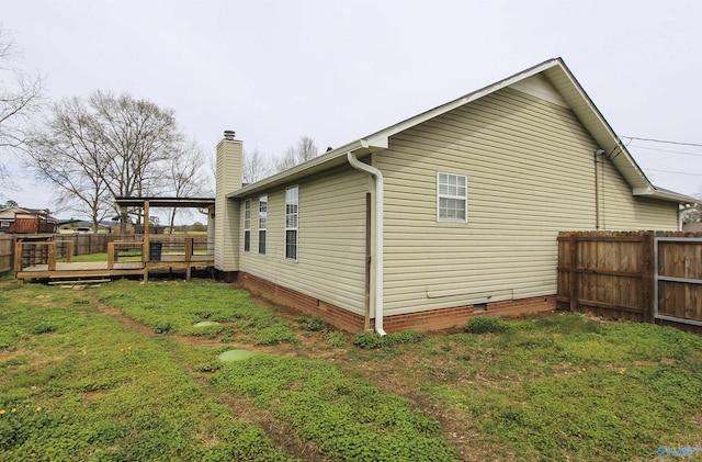 3790 Christopher Ave, Southside, AL 35907 - view of side of home with fence, crawl space, a deck, a yard, and a chimney