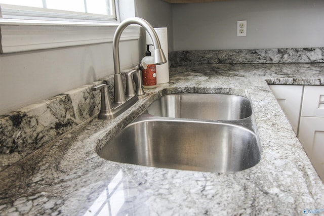 3790 Christopher Ave, Southside, AL 35907 - details with white cabinets and a sink
