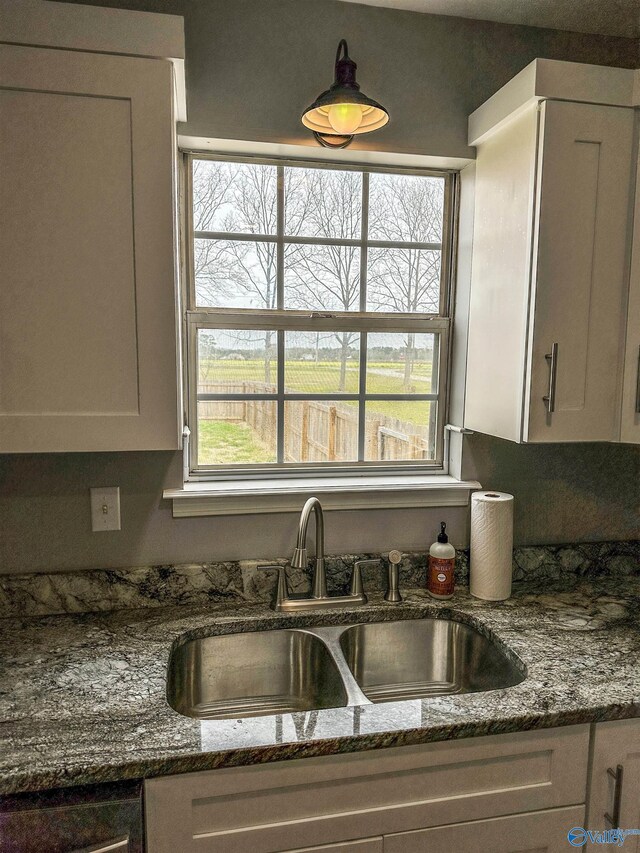 3790 Christopher Ave, Southside, AL 35907 - kitchen featuring white cabinets, a sink, and dark stone countertops
