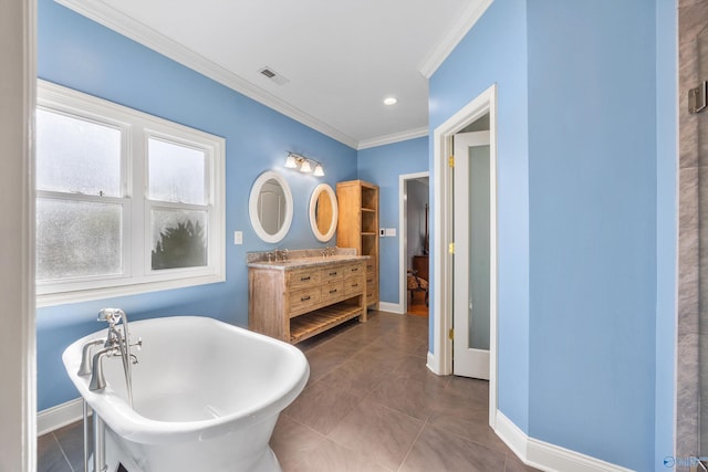 bathroom with tile patterned flooring, vanity, a tub to relax in, and crown molding