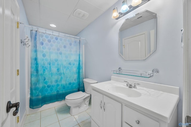 full bathroom with tile patterned flooring, vanity, shower / tub combo with curtain, and toilet