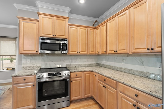 kitchen featuring tasteful backsplash, crown molding, light wood-style flooring, appliances with stainless steel finishes, and light stone countertops