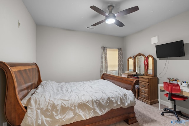bedroom with carpet, visible vents, baseboards, and ceiling fan