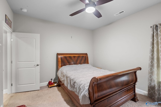 bedroom featuring carpet floors, visible vents, baseboards, and ceiling fan