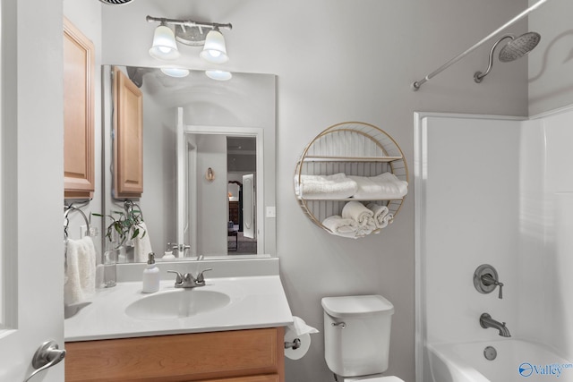 bathroom with shower / bathing tub combination, vanity, and toilet