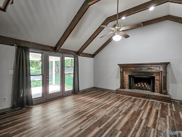 unfurnished living room featuring a brick fireplace, beamed ceiling, hardwood / wood-style flooring, and ceiling fan