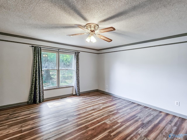 spare room featuring a textured ceiling, wood-type flooring, crown molding, and ceiling fan