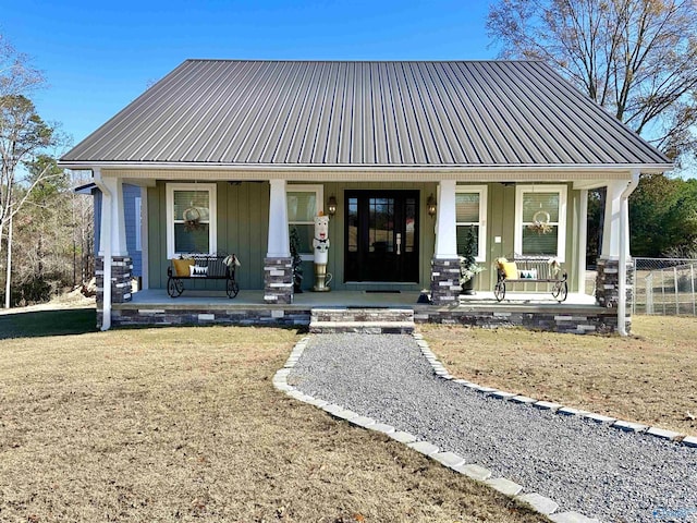 view of front of property with a porch and a front yard