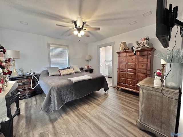 bedroom featuring connected bathroom, ceiling fan, and hardwood / wood-style flooring