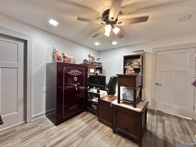 office space featuring ceiling fan and light hardwood / wood-style flooring