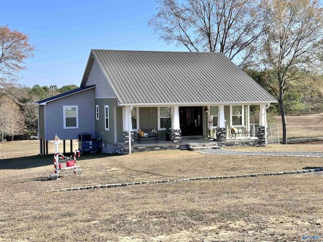 view of front of home featuring a porch and cooling unit