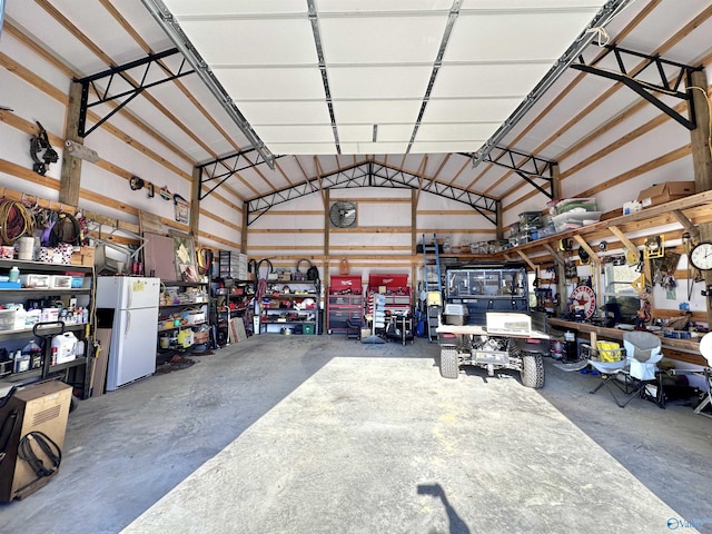 garage featuring white fridge