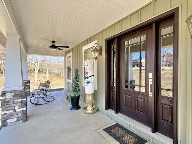 doorway to property featuring a porch and ceiling fan