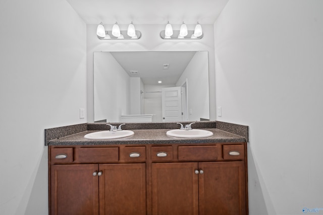 bathroom featuring vanity and walk in shower