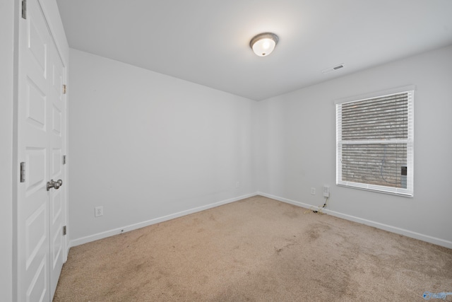 unfurnished room featuring carpet floors