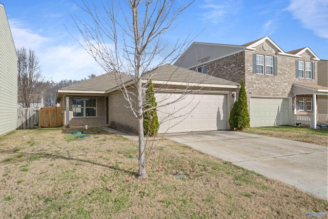 view of front of house with a garage and a front lawn