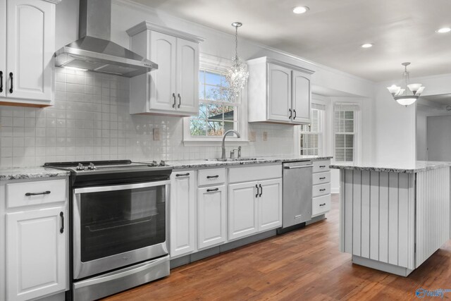 3000 Eolyne Kelly Way NE, Huntsville, AL 35811 - kitchen with a chandelier, appliances with stainless steel finishes, a sink, and wall chimney exhaust hood