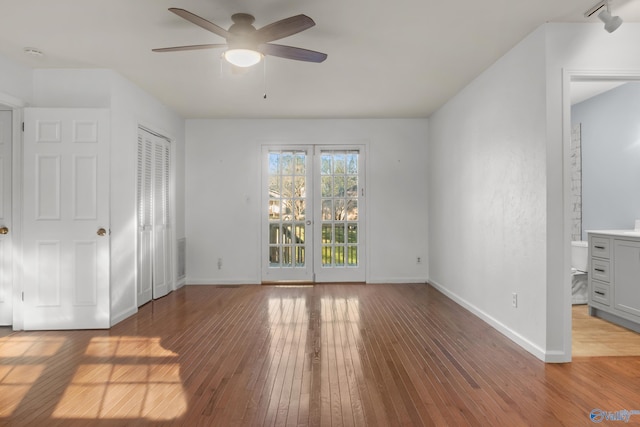 3000 Eolyne Kelly Way NE, Huntsville, AL 35811 - unfurnished bedroom with wood-type flooring, baseboards, access to outside, and a ceiling fan