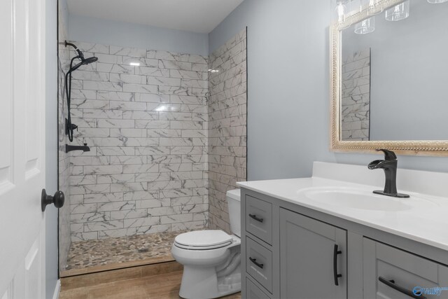 3000 Eolyne Kelly Way NE, Huntsville, AL 35811 - bathroom featuring toilet, wood finished floors, vanity, and a shower stall