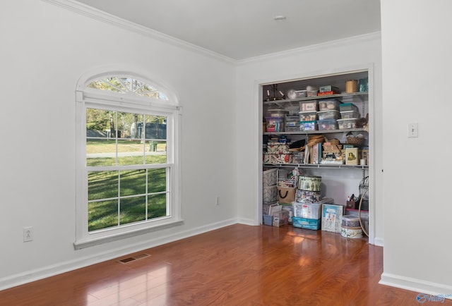 3000 Eolyne Kelly Way NE, Huntsville, AL 35811 - spare room featuring visible vents, baseboards, crown molding, and wood finished floors