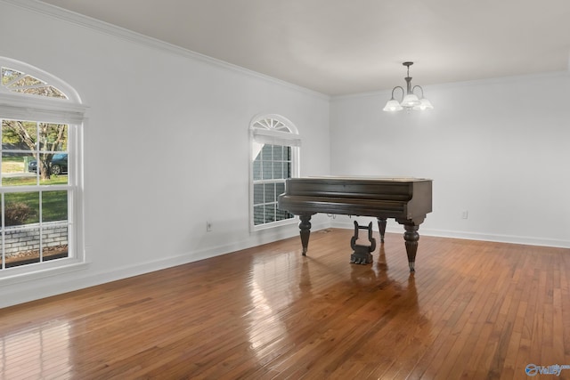 3000 Eolyne Kelly Way NE, Huntsville, AL 35811 - sitting room featuring baseboards, a notable chandelier, hardwood / wood-style flooring, and crown molding