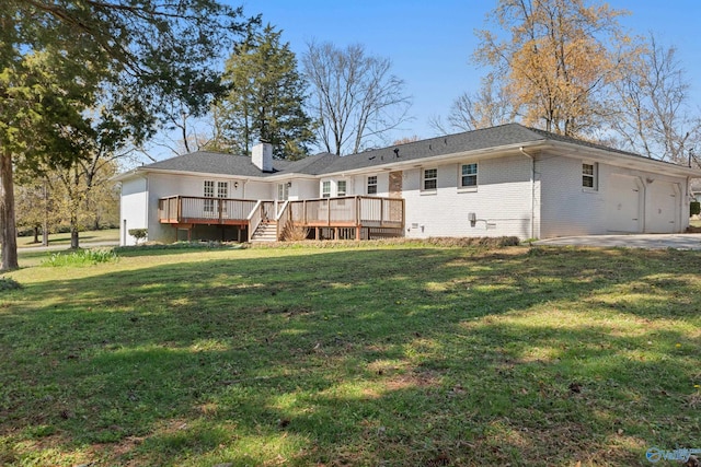 3000 Eolyne Kelly Way NE, Huntsville, AL 35811 - rear view of house with a chimney, an attached garage, brick siding, a wooden deck, and a yard