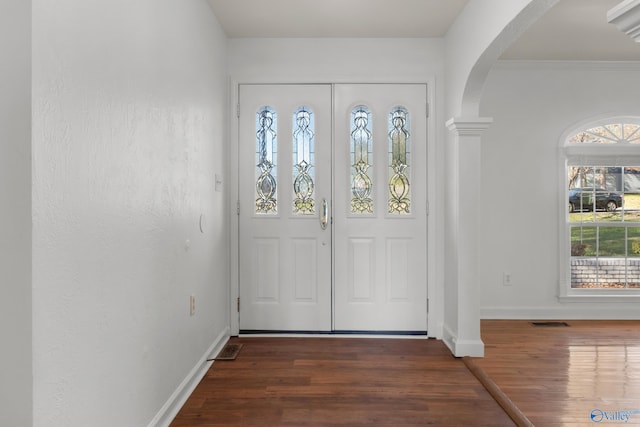 3000 Eolyne Kelly Way NE, Huntsville, AL 35811 - foyer entrance featuring arched walkways, visible vents, baseboards, and wood finished floors