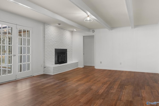 3000 Eolyne Kelly Way NE, Huntsville, AL 35811 - unfurnished living room featuring wood finished floors, beamed ceiling, baseboards, and a brick fireplace