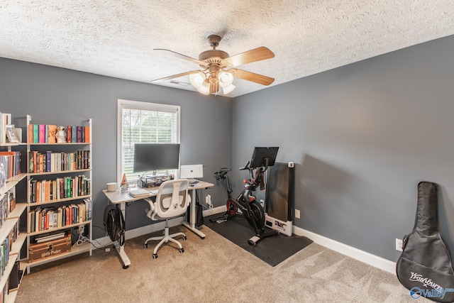 office area featuring carpet, ceiling fan, and baseboards