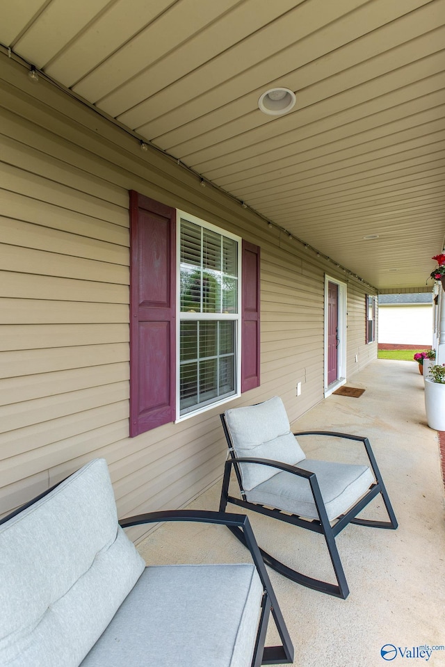 view of patio featuring a porch